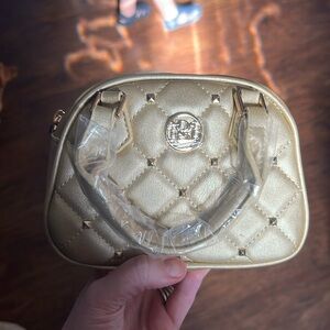 SOLD Gold small Badgley Mischka hand bag
